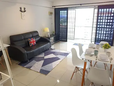 a living room with a black leather couch and a table at Georgetown, Up to 6 Pax, 3 Bedrooms, 1 Car Park by Star Home in Jelutong