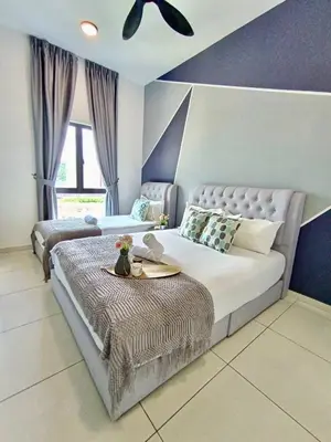 a bedroom with a large bed with a table on it at The Horizon Ipoh L8 by Grab A Stay in Ipoh