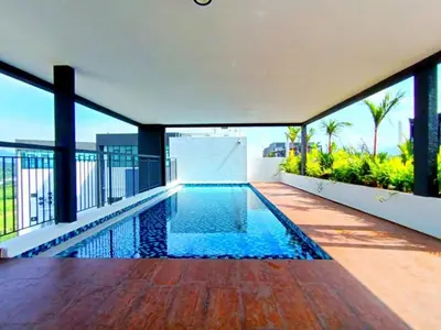 a swimming pool on the balcony of a house at The Horizon Ipoh L8 by Grab A Stay in Ipoh