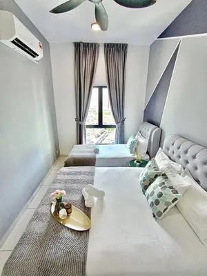 a bedroom with two beds and a ceiling at The Horizon Ipoh L8 by Grab A Stay in Ipoh