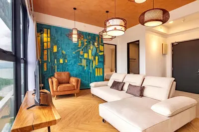 a living room with a couch and a tv at Urban Suites, Classic Collection by Stellar ALV in Jelutong