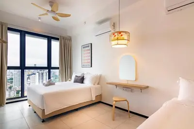 a hotel room with a bed and a window at Urban Suites, Classic Collection by Stellar ALV in Jelutong