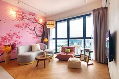 a living room with pink flowers on the wall at Urban Suites, Classic Collection by Stellar ALV in Jelutong
