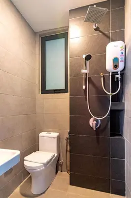 a bathroom with a toilet and a shower in it at Urban Suites, Spectre Collection by Stellar ALV in Jelutong