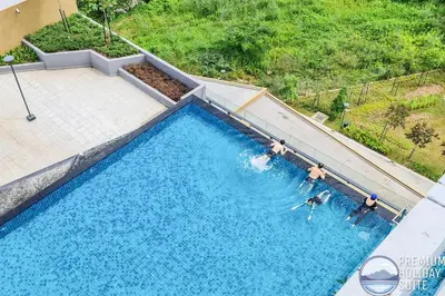 an overhead view of a swimming pool with people in it at Premium Holiday Suite beside Lost World Tambun at Sunway Onsen in Tambun