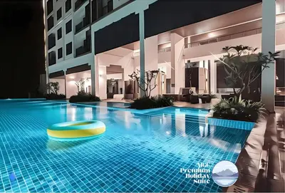 a hotel swimming pool with a yellow ring in the middle at Premium Holiday Suite beside Lost World Tambun at Sunway Onsen in Tambun