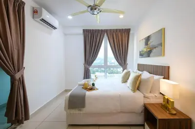 a bedroom with a large bed with a window at Deluxe Studio/Gurney/Mansion One in George Town