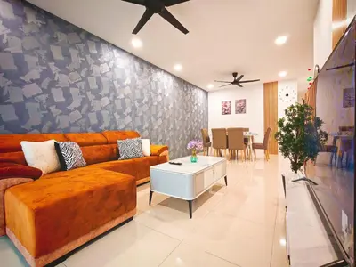 a living room with a couch and a table at Ipoh Manhattan Waterpark View 3BR Condo by City Home Empire MHD704 in Ipoh