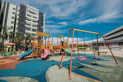 a playground with slides and swings at Ipoh Manhattan Waterpark View 3BR Condo by City Home Empire MHD704 in Ipoh