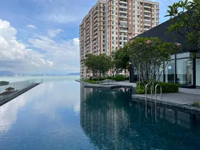 a large pool of water in front of a building at Urban Suites - George Town, Penang in Jelutong
