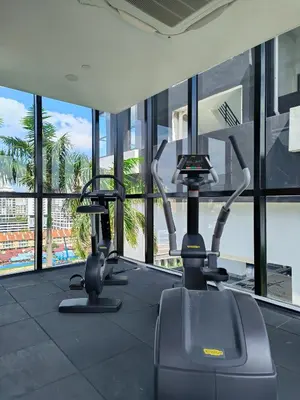 a gym with three exercise bikes in a building at Urban Suites - George Town, Penang in Jelutong