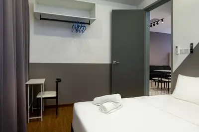 a bedroom with a bed with a basketball hanging on the wall at Penang KTHOME Beacon Executives suite in George Town