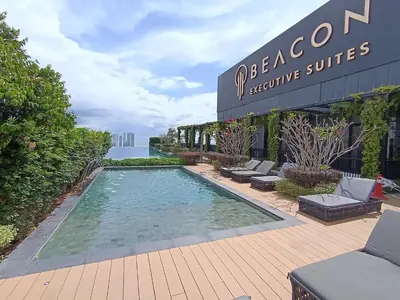 a swimming pool in front of a building at Penang KTHOME Beacon Executives suite in George Town
