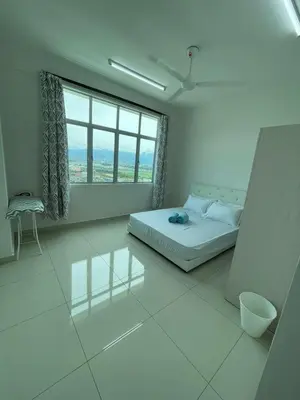 a white room with a bed and a large window at Rumah Puteh Homestay in Ipoh