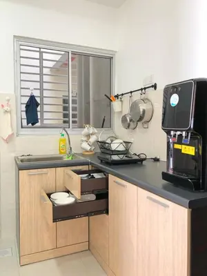 a kitchen with a counter with a sink and a microwave at Sekinchan Simple LoveSea House ~ Seaview 3-14AB in Sekincan