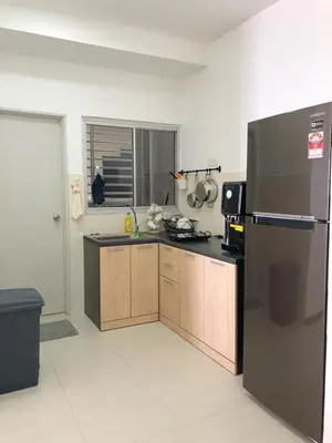 a kitchen with a refrigerator and a counter top at Sekinchan Simple LoveSea House ~ Seaview 3-14AB in Sekincan