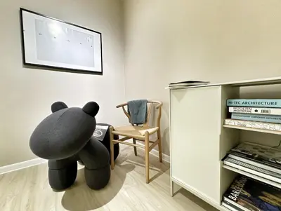 a teddy bear sitting on the floor in a room at Designer Guesthouse Pulau Tikus & Gurney Drive, Georgetown, Penang in George Town