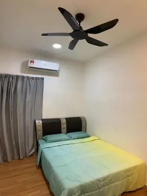 a bedroom with a bed with a ceiling fan at Sekinchan Simple Love SeaHouse - PaddyView 8-7A in Sekincan