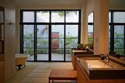 a large bathroom with two sinks and a tub at Quint Residence, Georgetown - Rustic Heritage Guesthouse by ALV in George Town
