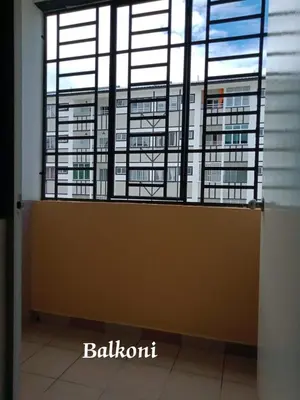 a room with a large window in a building at Hakimi Homestay in Tanah Rata