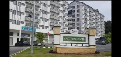 a sign in front of a large building at Hakimi Homestay in Tanah Rata
