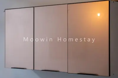 a sliding glass door with the words mowin homnesota at Comfy Studio Room by Moowin in Perai
