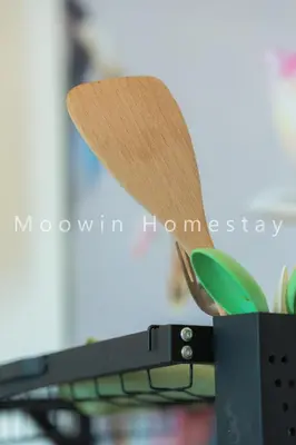 a pair of scissors sitting on top of a laptop computer at Comfy Studio Room by Moowin in Perai