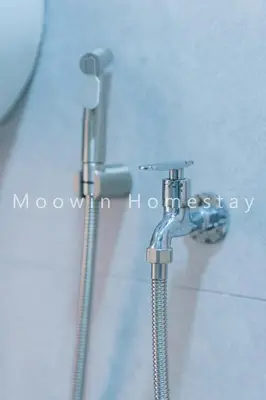 a shower head in a bathroom next to a shower at Comfy Studio Room by Moowin in Perai