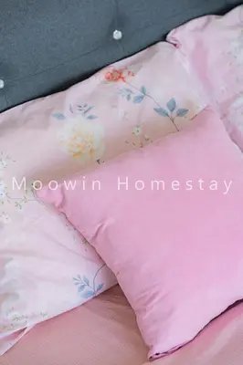 a pink pillow sitting on top of a bed at Comfy Suite by Moowin in Perai