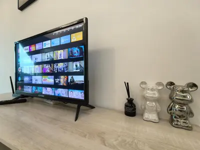 a flat screen tv sitting on top of a table at Summer Cozy Big Studio in Perai