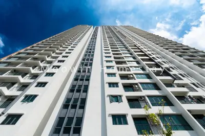 a tall white building looking up at the sky at Summer Cozy Big Studio in Perai