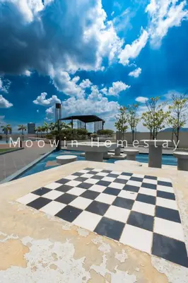 a chess board in front of a roller coaster at Summer Cozy Big Studio in Perai