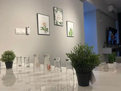 a glass table with vases and potted plants on it at IPOH TAMBUN THE COVE Your Ultimate Relaxation Getaway777 -3 BED ROOM -NO PETS ALLOW in Ipoh