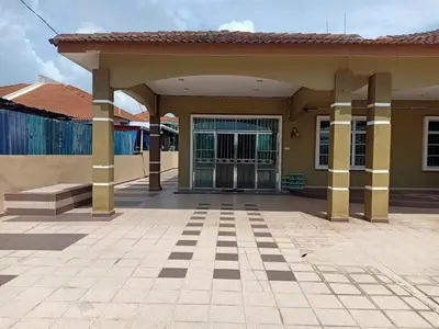 a building with a gate in a courtyard at JZ at Sungai Besar Single Storey Semi-D in Sungai Besar