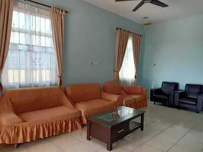 a living room with two couches and a coffee table at JZ at Sungai Besar Single Storey Semi-D in Sungai Besar