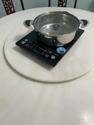 a bowl on top of a remote control on a table at JZ at Sungai Besar Single Storey Semi-D in Sungai Besar