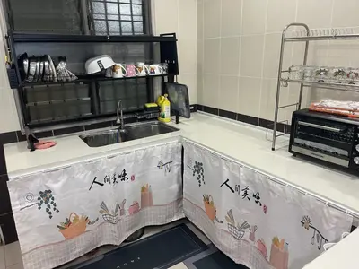 a kitchen with a sink and a counter top at JZ at Sungai Besar Single Storey Semi-D in Sungai Besar