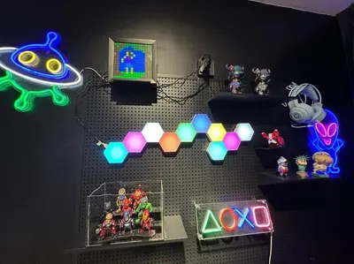 a room with a wall with neon lights and toys at 3 Room/3 Queen Bed, Urban Suite Arcade Room #2carpark in Jelutong