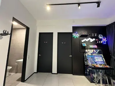 a room with three black doors and a mirror at 3 Room/3 Queen Bed, Urban Suite Arcade Room #2carpark in Jelutong