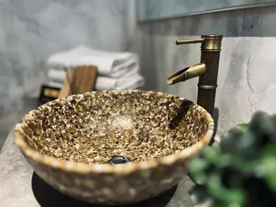 a bathroom sink with a counter top with a sink at The Ash Ipoh - Family Suite in Ipoh