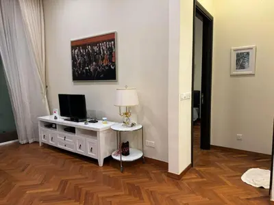 a living room with a desk with a computer on it at Perfect Marina @ Strait Quay /w Exclusive Stay in Tanjong Tokong