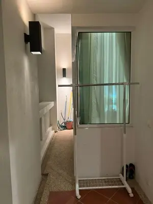 a hallway with a glass shower in a room at Perfect Marina @ Strait Quay /w Exclusive Stay in Tanjong Tokong