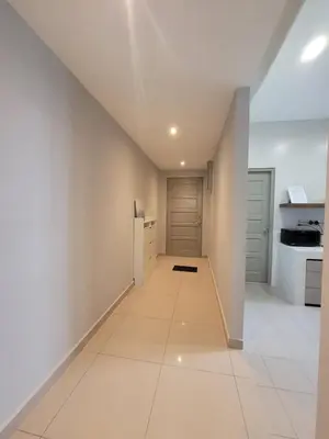 a hallway in a house with white walls and white floors at Venus Cozy Home in Seri Manjung