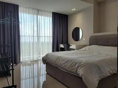 a bedroom with a bed and a large window at Venus Cozy Home in Seri Manjung