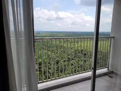 a view of a balcony from a room with a window at Venus Cozy Home in Seri Manjung