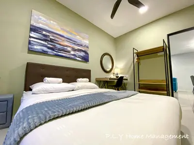 a bedroom with a large white bed and a desk at Crystal Cozy Suite PoolView Netflix Waterpark@ Ipoh Station 18 in Ipoh