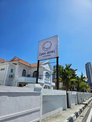 a sign for a hotel in front of a building at Luna Hotel by Moonknight in George Town
