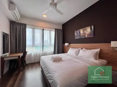 a bedroom with a bed and a desk and a window at Ojieshome 1BR Sunway Onsen Tambun in Tambun