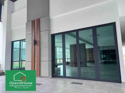 an office building with glass doors and a sign on it at Ojieshome 1BR Sunway Onsen Tambun in Tambun