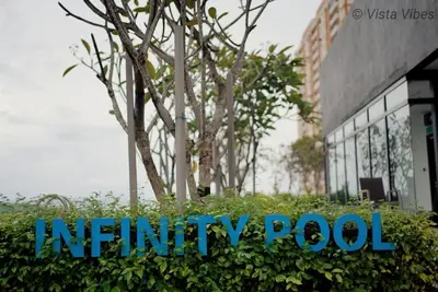 a sign for aninity pool in front of a building at Urban Suites Homestay by Vista Vibes in Jelutong